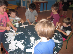 Pre-school children paint crosses